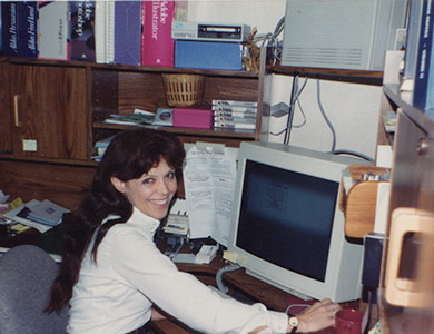 Carol Grosvenor at her desk, 1990.