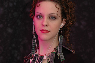 photo of young woman wearing jewelry made from spare computer parts, mainly DRAM